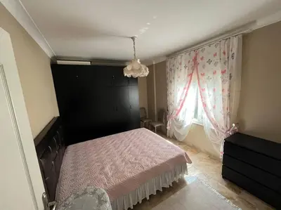 a bedroom with a pink bed and a window at Villa Elysium in Gebze