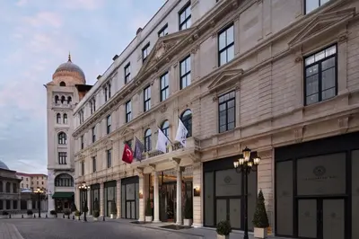 a large building with a clock tower in the background at Sanasaryan Han, a Luxury Collection Hotel, Istanbul in Istanbul