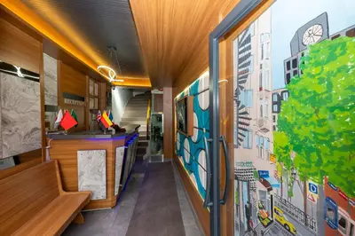 a hallway of a school with a mural on the wall at mayza otel in Istanbul