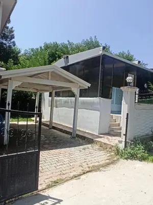 a building with a pavilion next to a skate park at Grandvadi Villa kapalı ısıtmalı havuz in Sapanca