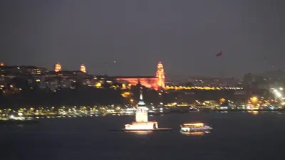 a lighthouse in the middle of the water at night at Bosphorus view-Airport shutle-High Speed WIFI-Private parking in Istanbul