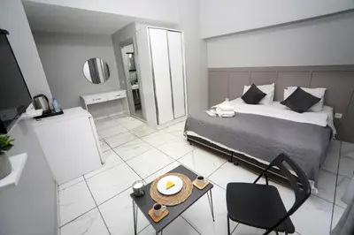 a bedroom with a bed and a table with a plate on it at Arkem Maltepe in Istanbul