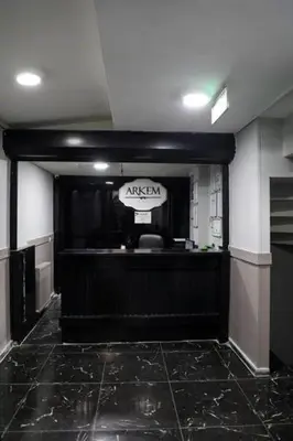 a room with a black counter with aania sign in it at Arkem Maltepe in Istanbul