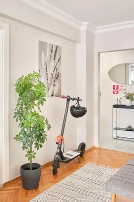 a room with a scooter next to a plant at Charming Bagdat Avenue Hideaway, Near Marina in Istanbul