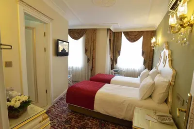 a hotel room with a large bed in a room at Galatower Hotel in Istanbul