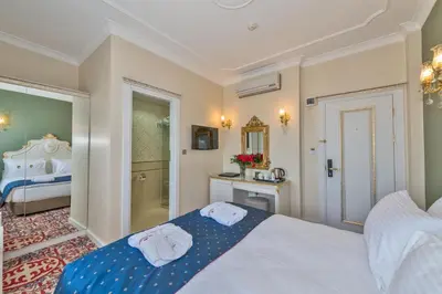 a bedroom with a bed with towels on it at Galatower Hotel in Istanbul