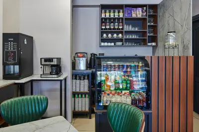 a bar with a refrigerator filled with drinks at Pera Life in Istanbul