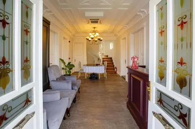 a hallway with couches and a table in a room at Mansion Miliá in Adalar
