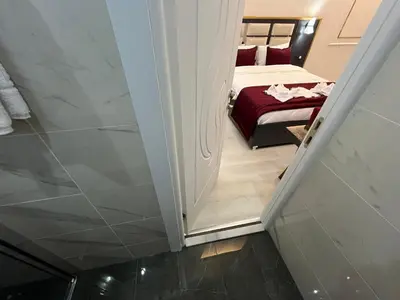 a stairway leading to a bedroom with a bed at Lale Sultan Hotel in Istanbul