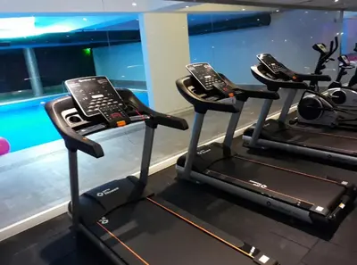 a gym with two exercise machines with phones on them at NEW FALCON PALAS OTEL in Istanbul
