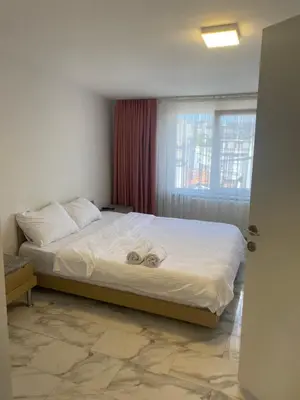 a bedroom with a bed with two towels on it at HOTEL YEDİkapı in Istanbul