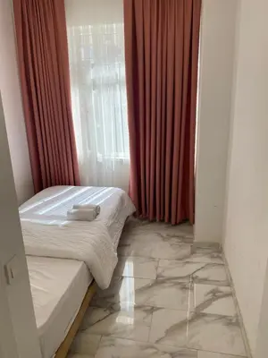 a small bedroom with a bed and a window at HOTEL YEDİkapı in Istanbul