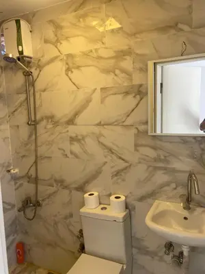 a bathroom with a toilet and a sink and a mirror at HOTEL YEDİkapı in Istanbul