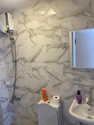 a bathroom with a toilet and a sink and a mirror at HOTEL YEDİkapı in Istanbul