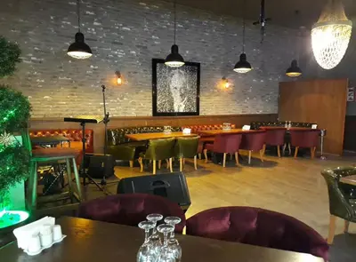 a restaurant with tables and chairs and a bar at NEW FALCON Palas OTEL in Istanbul