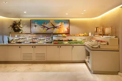 a restaurant kitchen with a counter with food at Bentley Hotel Old City-Special Class in Istanbul