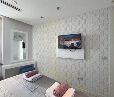 a bedroom with a bed and a painting on the wall at Exquisite Ottomare Suites in Istanbul