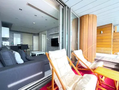 a living room with a couch and a table and chairs at Exquisite Ottomare Suites in Istanbul