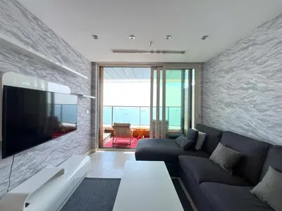 a living room with a couch and a flat screen tv at Exquisite Ottomare Suites in Istanbul
