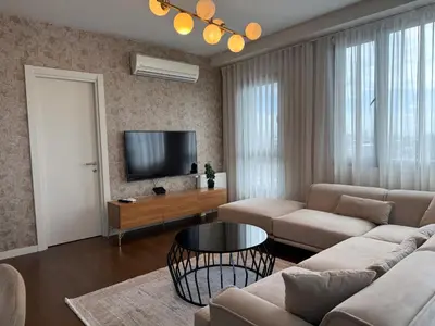 a living room with a couch and a tv at konforun adresi in Istanbul