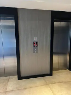two elevators in a building with their doors open at konforun adresi in Istanbul