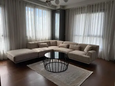 a living room with a couch and a table at konforun adresi in Istanbul
