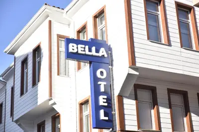 a blue sign for a hotel in front of a building at Bella Otel Mudanya in Mudanya