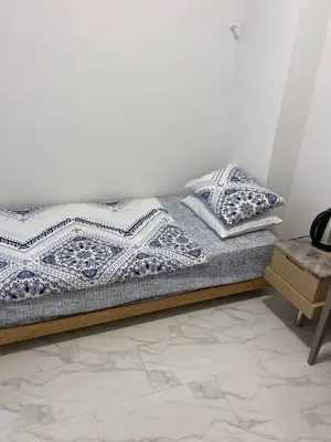 a bed with two pillows on it in a room at YENİkapı in Istanbul