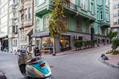 a scooter parked on the side of a street at Duplex Modern City Gem with Terrace in Istanbul