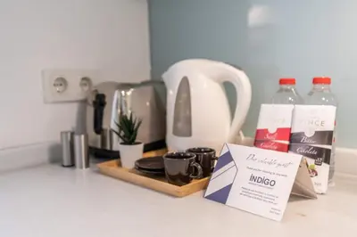 a kitchen counter with a coffee maker and a sign at Cozy Getaway - Warmth and Comfort in the City in Istanbul