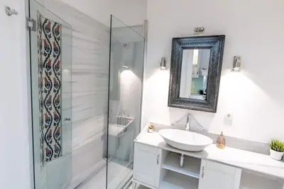 a bathroom with a sink and a shower at Cozy Getaway - Warmth and Comfort in the City in Istanbul