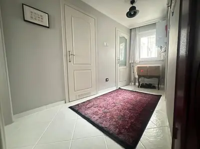 a room with a door and a red rug on the floor at 5 Min Walk Distance Taksim Square Semi Sea View in Istanbul