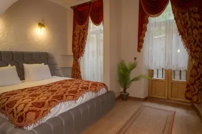 a bedroom with a bed and a large window at BeyPort Hotel Istanbul in Istanbul