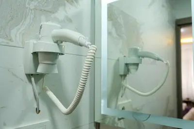 a bathroom with a phone on the wall at Yellow Mansion in Istanbul