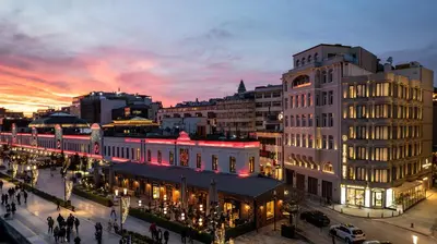 a view of a city at night with a building at Dream Inn Karaköy Bosphorus in Istanbul