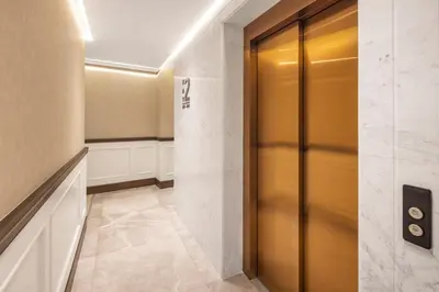 a elevator lobby with a gold elevator door at Dream Inn Karaköy Bosphorus in Istanbul