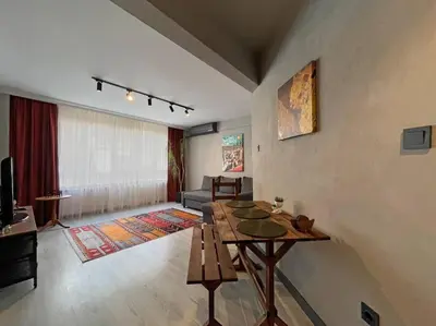a living room with a table and a couch at Central & cosy flat for 4 Person in Istanbul
