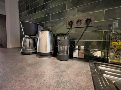 a counter with two coffee machines on it at Central & cosy flat for 4 Person in Istanbul