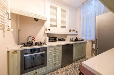 a kitchen with a sink and a stove top oven at Elegant, spacious, quiet 3br near historic center in Istanbul
