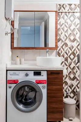 a bathroom with a washing machine and a sink at ERDEM in Istanbul