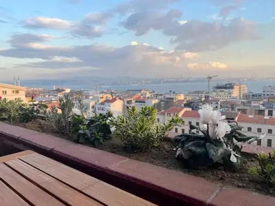 a view of a city from a rooftop with a bench at Magnificent view, in the center in Istanbul