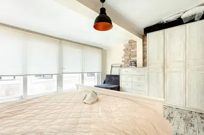 a large bedroom with a large bed and a lamp at Prime location with terrace in Istanbul
