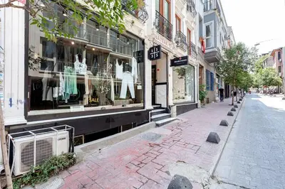 a city street with a store front with windows at Central location with 2 bedrooms in Istanbul
