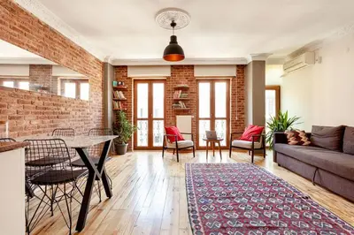 a living room with a brick wall at Central location with 2 bedrooms in Istanbul