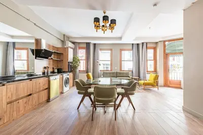 a kitchen and dining room with a table and chairs at Stunning Bright Central Modern 1BD Balat Gem! #328 in Istanbul