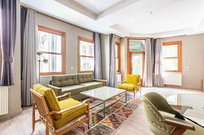 a living room with a couch and chairs and a table at Stunning Bright Central Modern 1BD Balat Gem! #328 in Istanbul