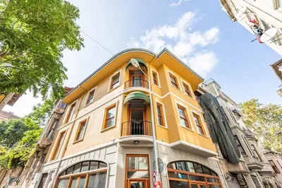 a yellow building with a round top at Stunning Bright Central Modern 1BD Balat Gem! #328 in Istanbul