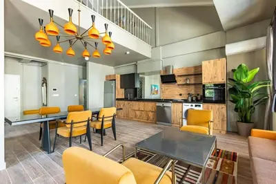 a kitchen and dining room with a table and chairs at Beautiful Bright Cool Modern 1BD Balat Loft! #329 in Istanbul