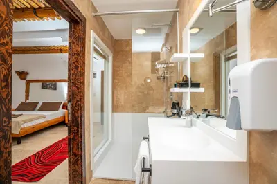 a bathroom with a sink and a bed in a room at PASHA PALACE HOTEL in Istanbul