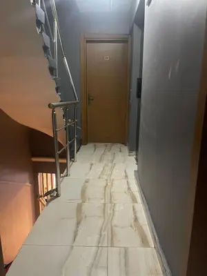 a long hallway with a staircase and a door at Ufuk Hotel in Istanbul